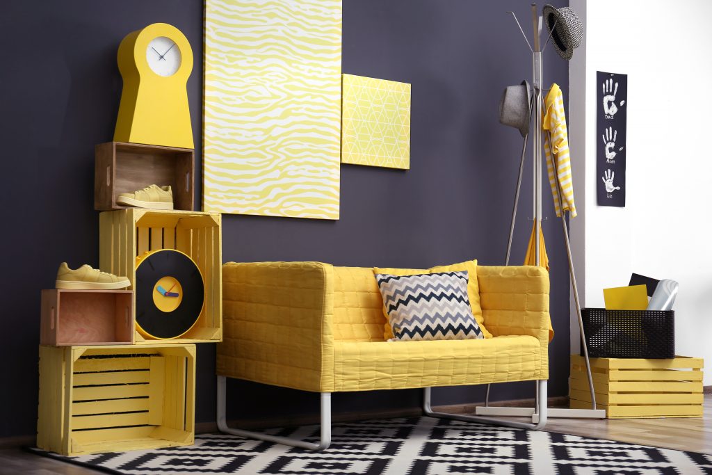 yellow sofa and grey wall 