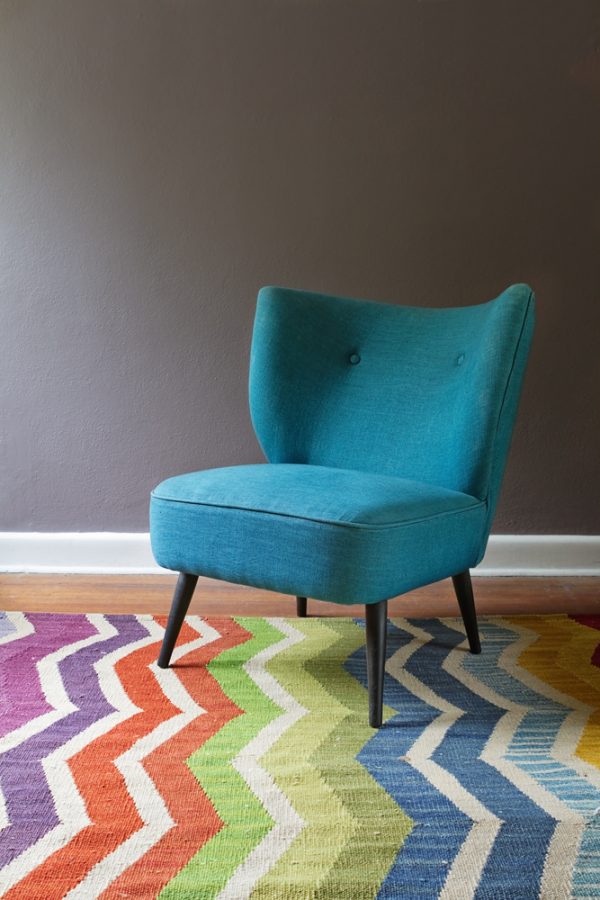 chevron pattern rugs and blue sofa