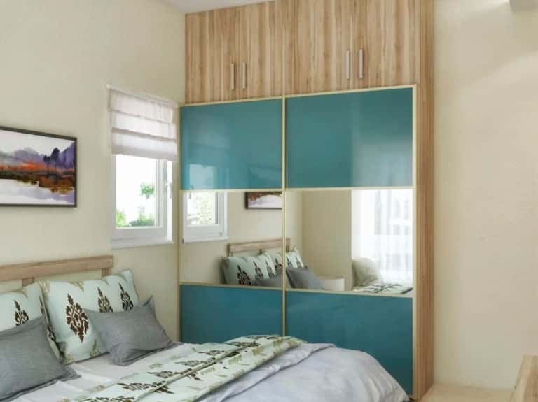 teal wardrobe with a mirror panel