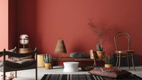 maroon wall with brown coffee table 