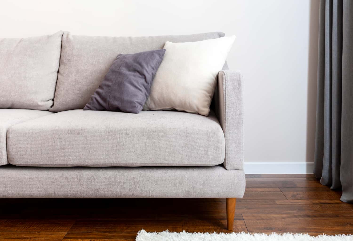grey sofa with pop colour cushions