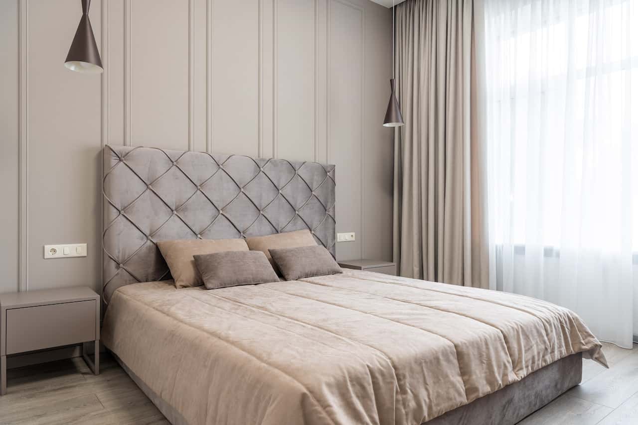 low bed design in muted nude tones