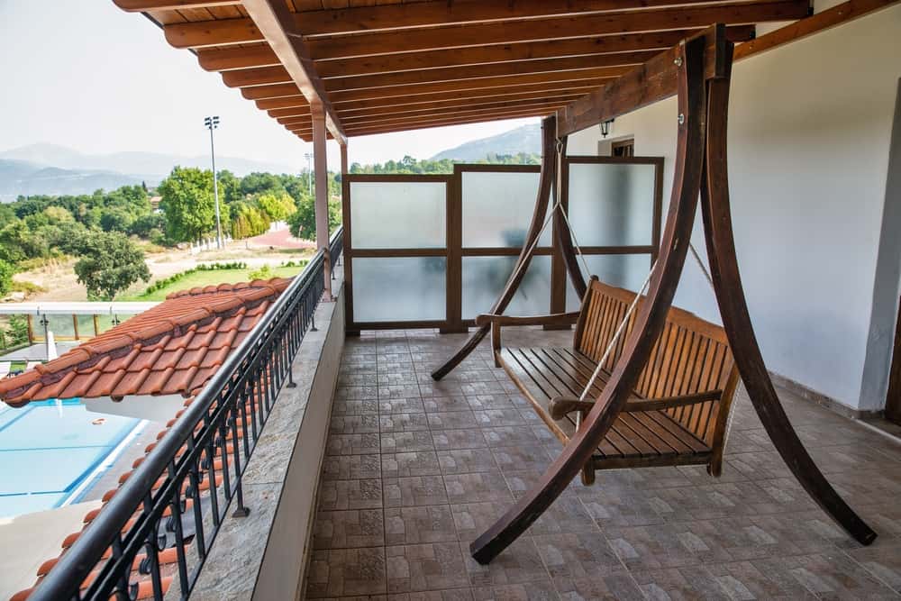 simple wooden balcony swing