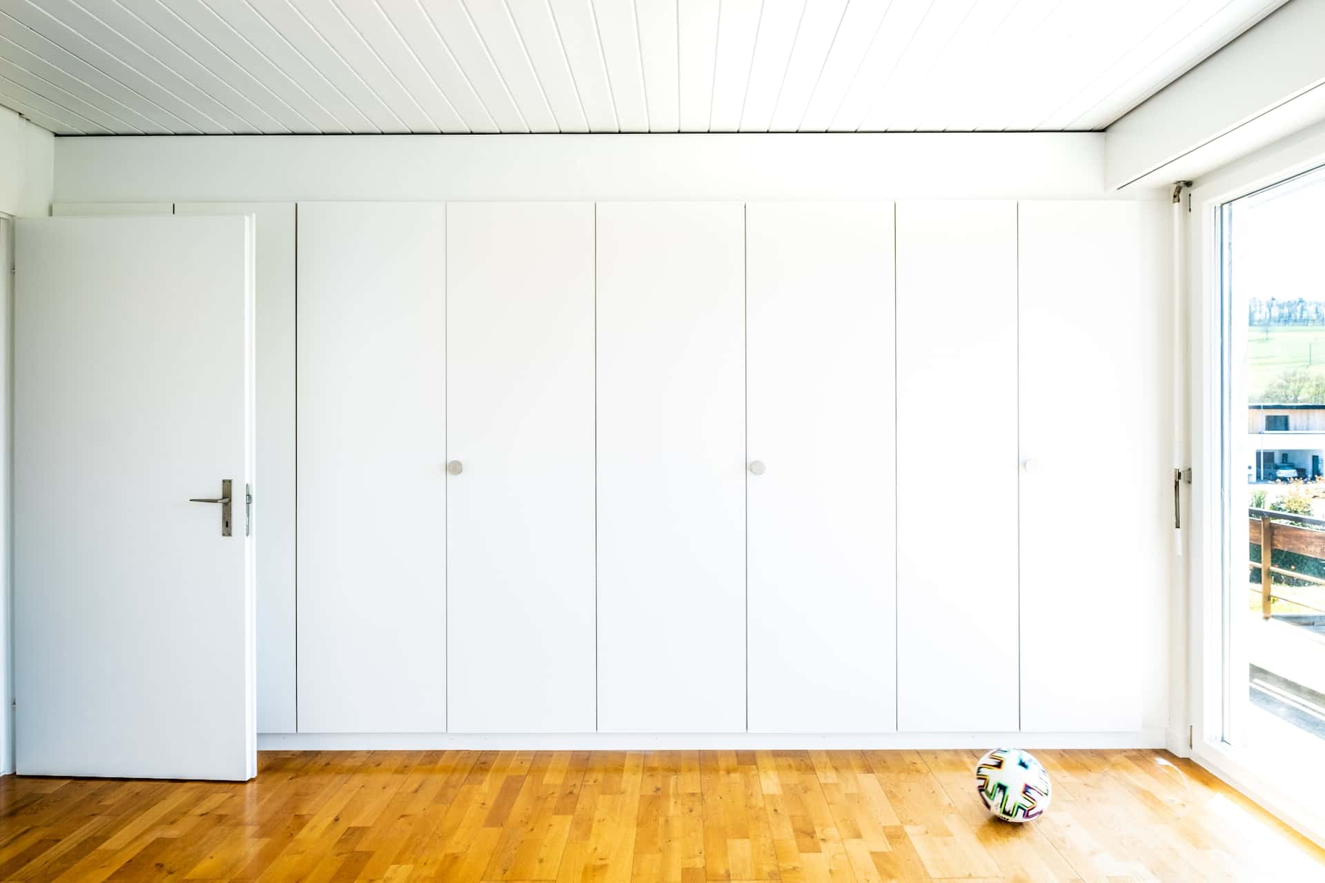 white wardrobe with high-gloss doors