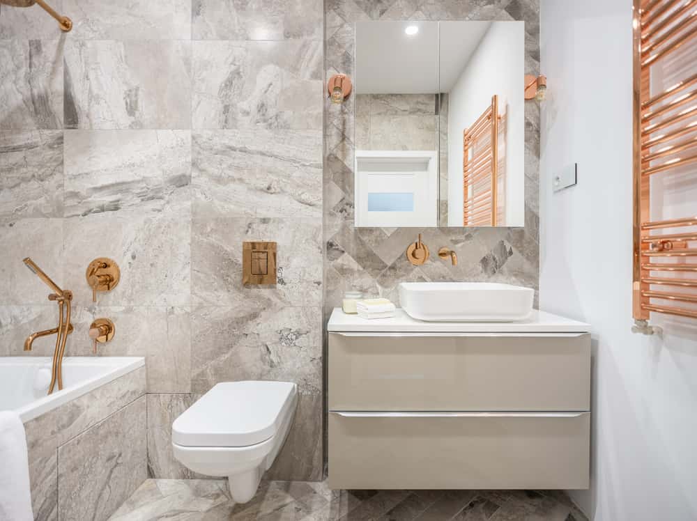 bathroom pop design with gold fixtures
