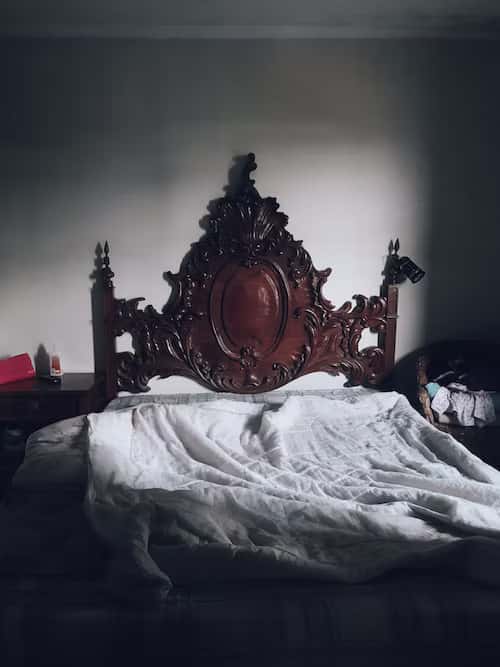 elaborate carved wooden bed