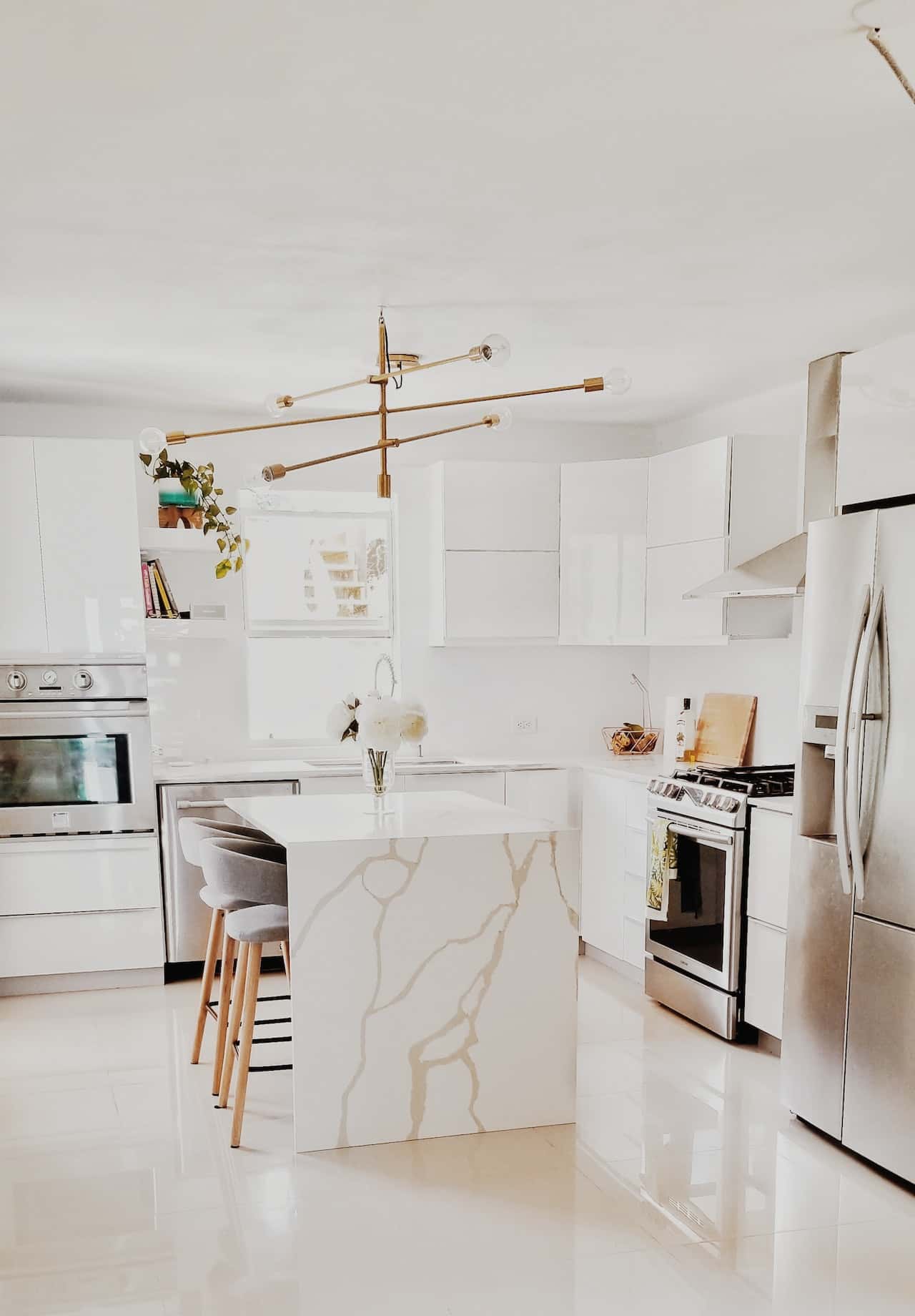 stark white glass modular kitchen