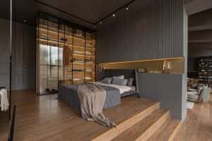 bedroom freestanding bath behind glass partition